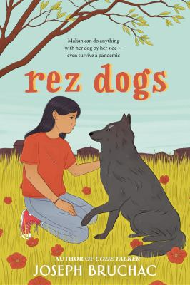 A person kneeling on the ground with a dog who has their paw on their knee.