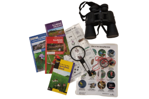 hiking kit with trail maps, binoculars, compass, scavenger hunt.
