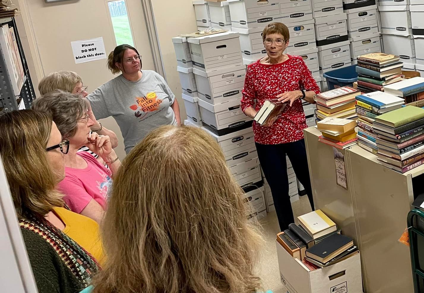 The Friends of the Library President explaining what needs to be done for setting up the Annual Book Sale