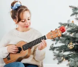 woman playing ukulele
