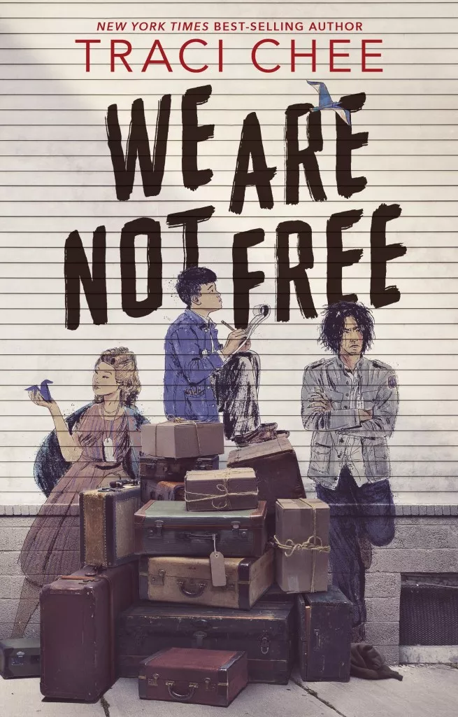 The teenagers painted on the side of a house, the girl looking at a paper crane, a boy sitting and writing, and a boy looking discontent; all with a pile of real luggage in front of it