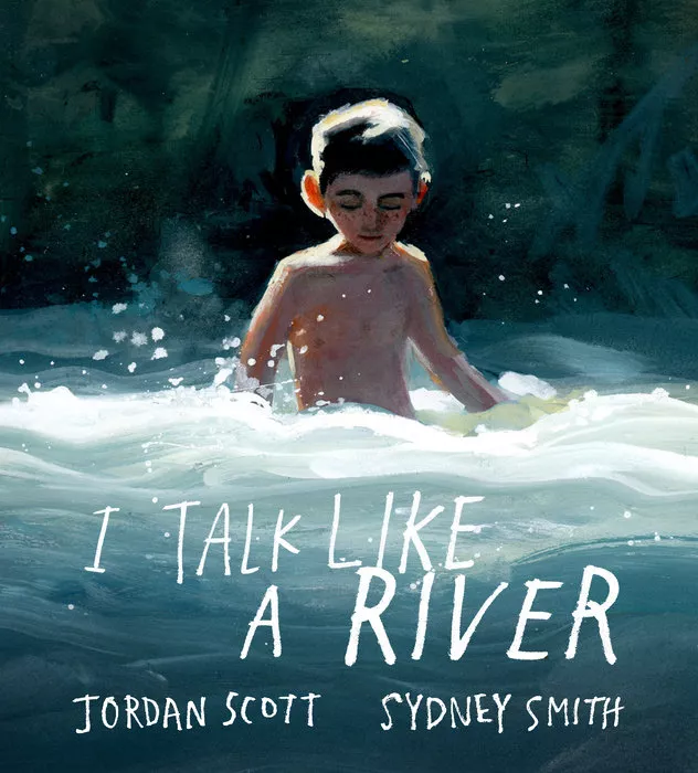 A shirtless boy walking through a river